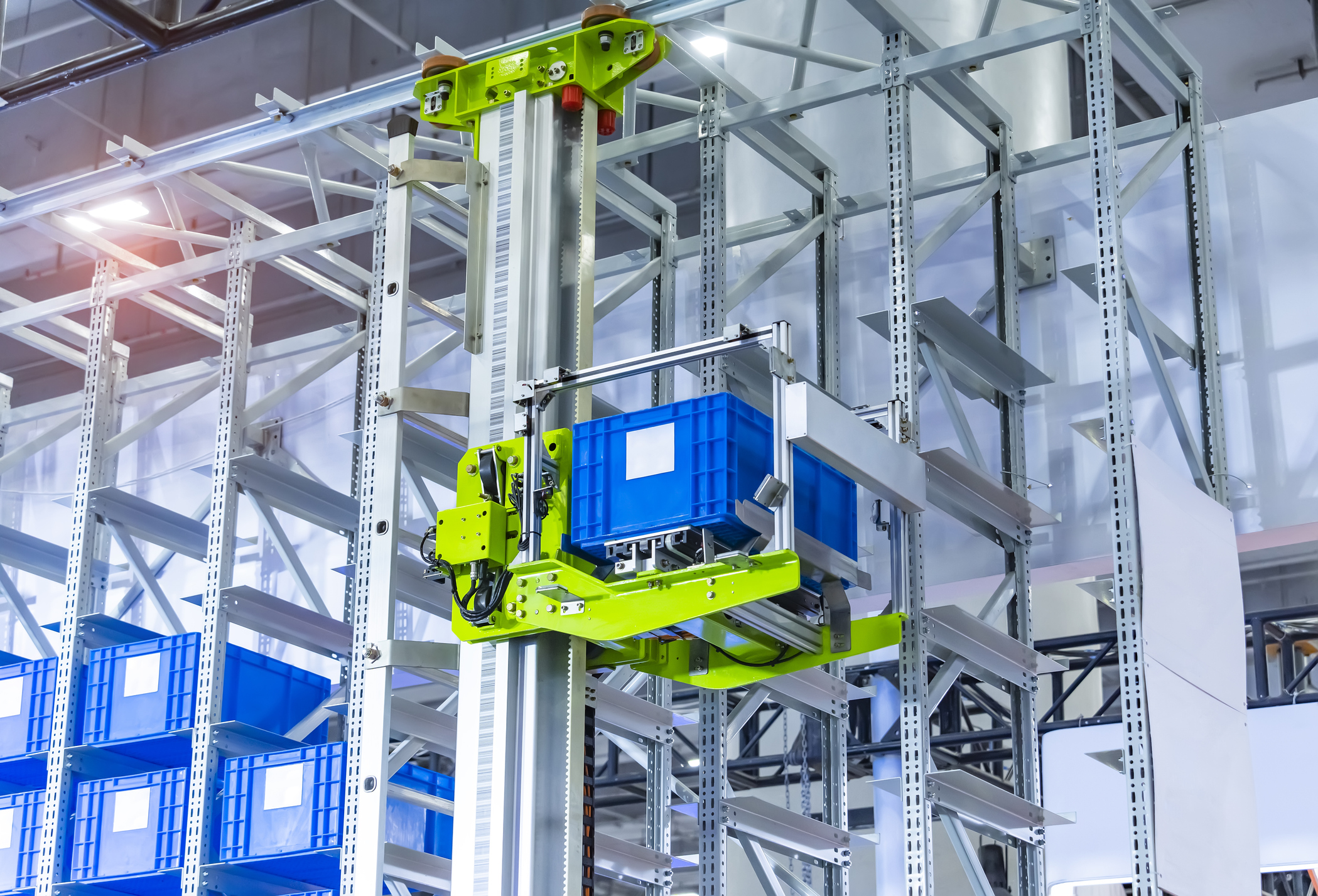 plastic boxes in the cells of the automated warehouse. Metal construction warehouse shelving