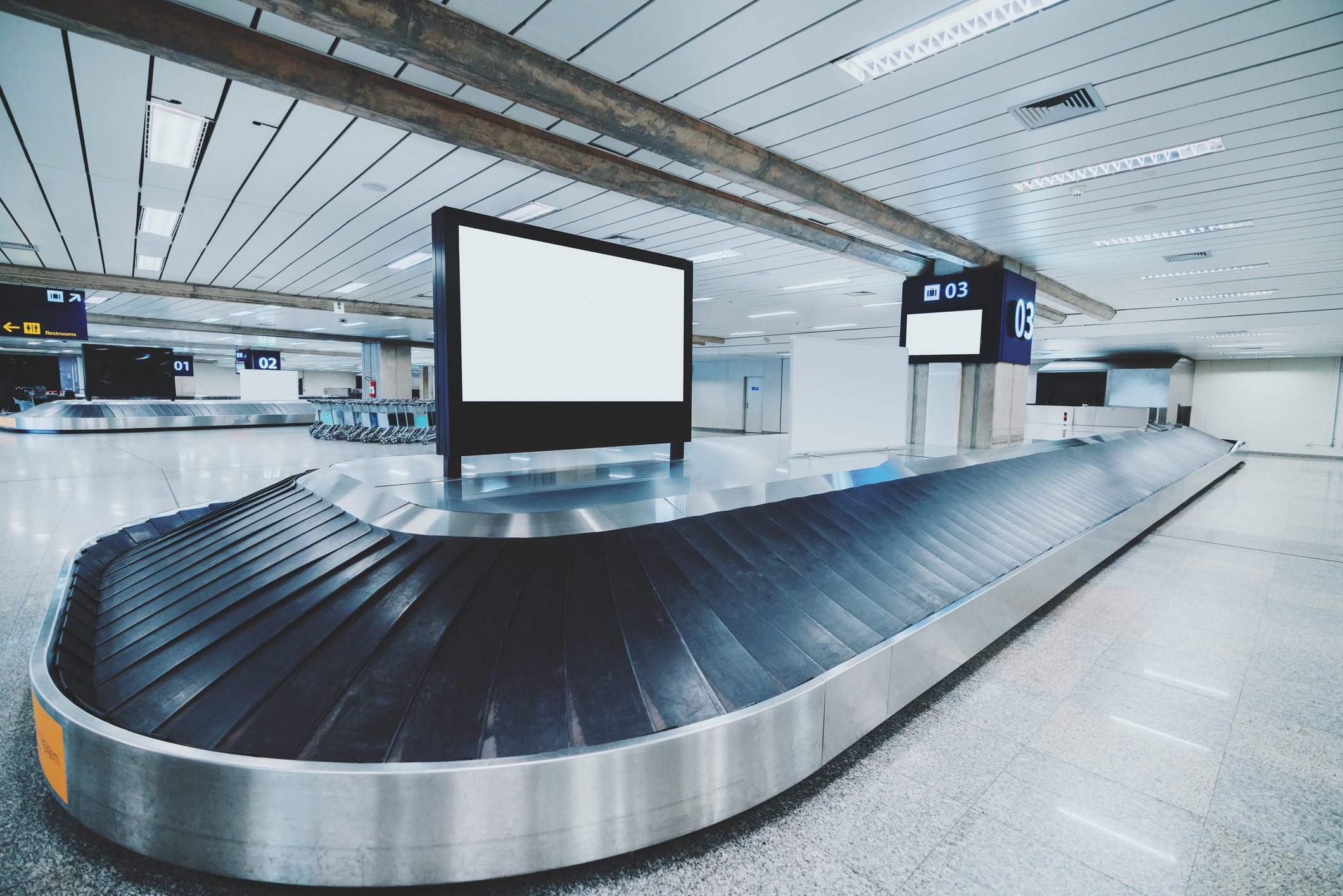 Conveyor belt with screen mockup on it, airport terminal